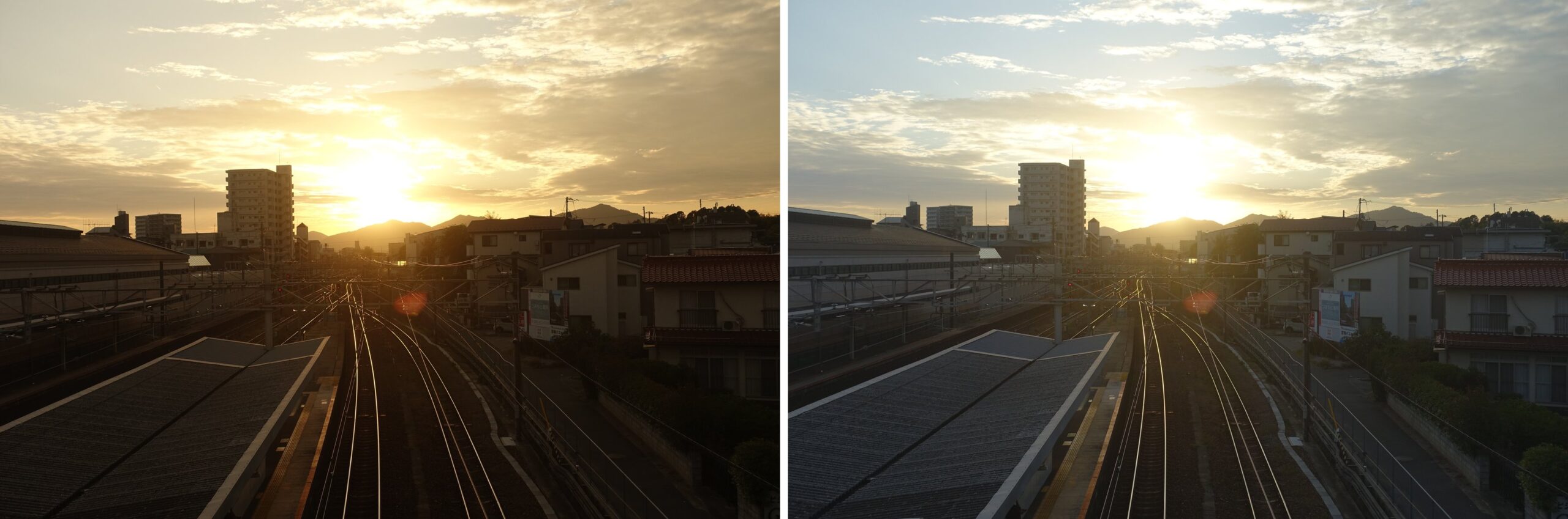 西条駅の構内から、線路の先の山にかかる夕日を撮った2枚。左の夕景モードは空と雲が金色で、ホームの屋根や家は暗い茶色。右のおまかせオートは空の高いところが水色と白で、屋根や家が明るい